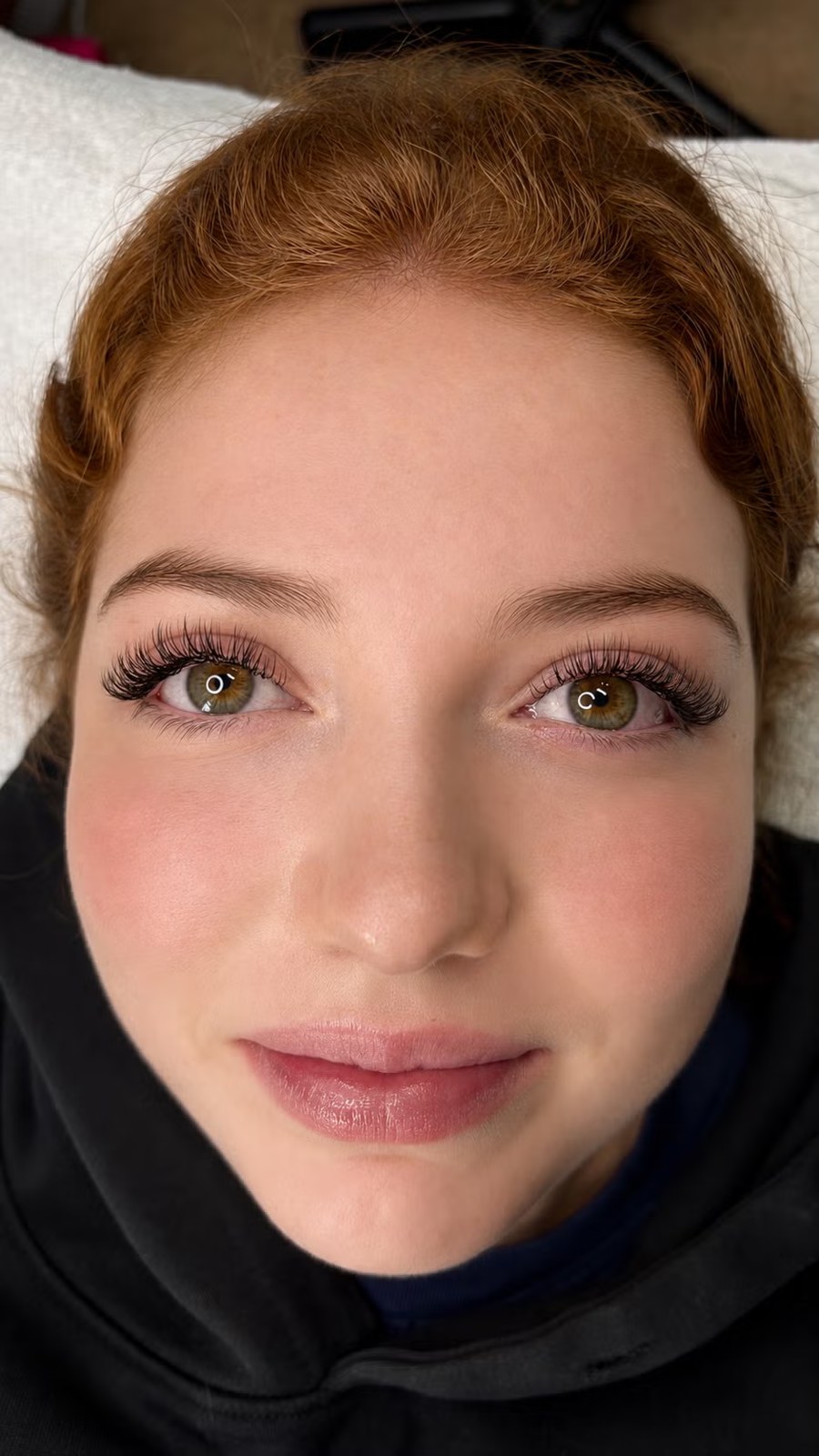 A Flirty Studios client showing a finished lash extension set.
